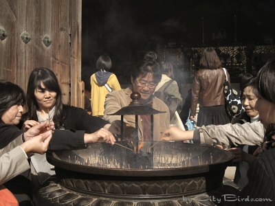 Burning Incense in front of the Temple