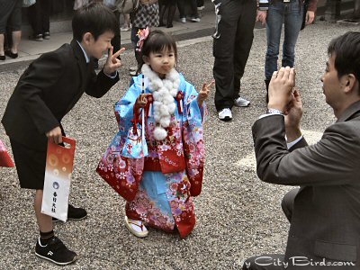 A Boy and Girl in Traditional Dress being Photographed